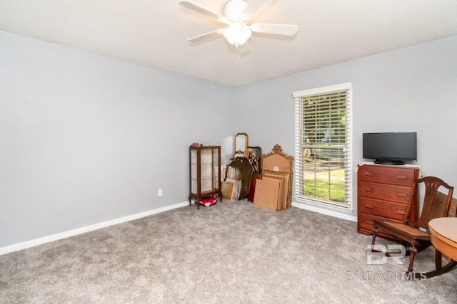 interior space featuring ceiling fan and carpet floors