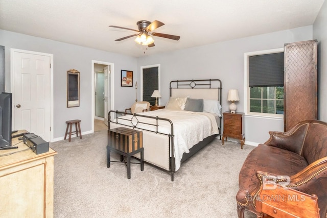 bedroom featuring ceiling fan and light carpet