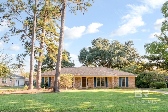 single story home featuring a front lawn