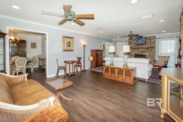 living room featuring a fireplace, crown molding, dark hardwood / wood-style flooring, and ceiling fan