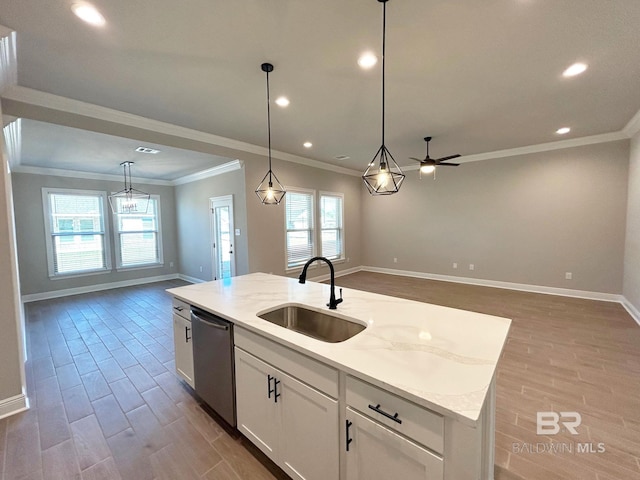 kitchen featuring stainless steel dishwasher, wood finished floors, open floor plan, and a sink