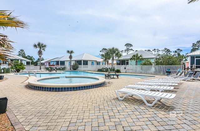 pool featuring a patio area and fence