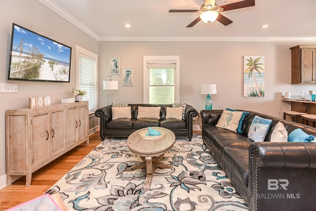 living area featuring ceiling fan, ornamental molding, recessed lighting, and light wood-style floors