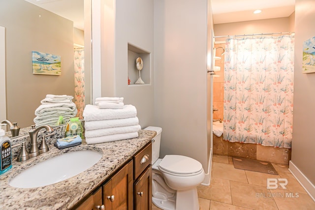 bathroom with baseboards, toilet, tile patterned floors, shower / bathtub combination with curtain, and vanity