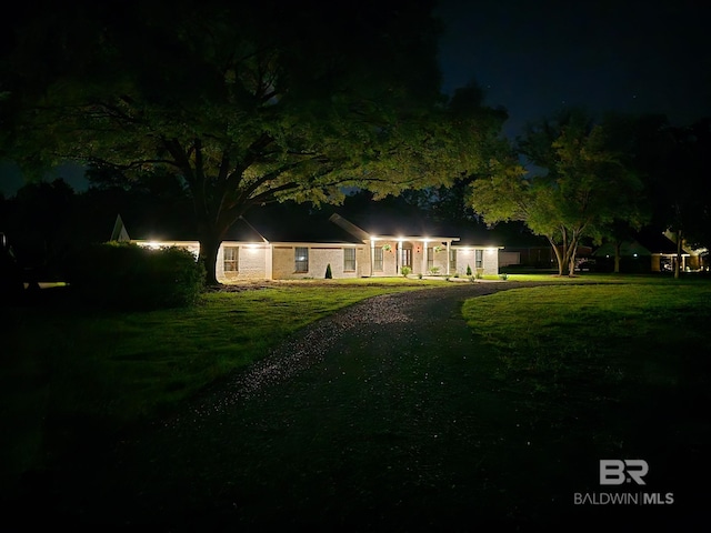 view of front of house with a yard
