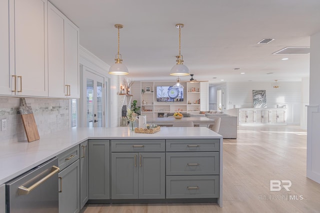 kitchen with stainless steel dishwasher, a peninsula, gray cabinets, backsplash, and recessed lighting