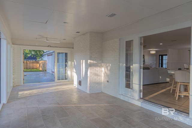 view of patio featuring fence