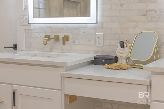 bathroom featuring backsplash and vanity