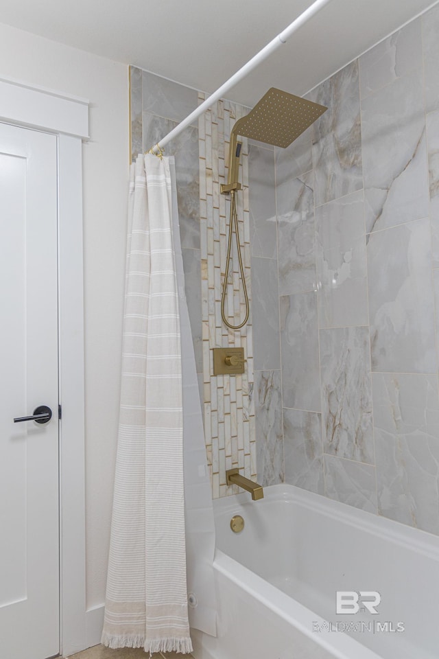 bathroom featuring shower / tub combo with curtain