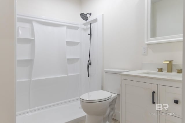 bathroom with toilet, a shower, and vanity