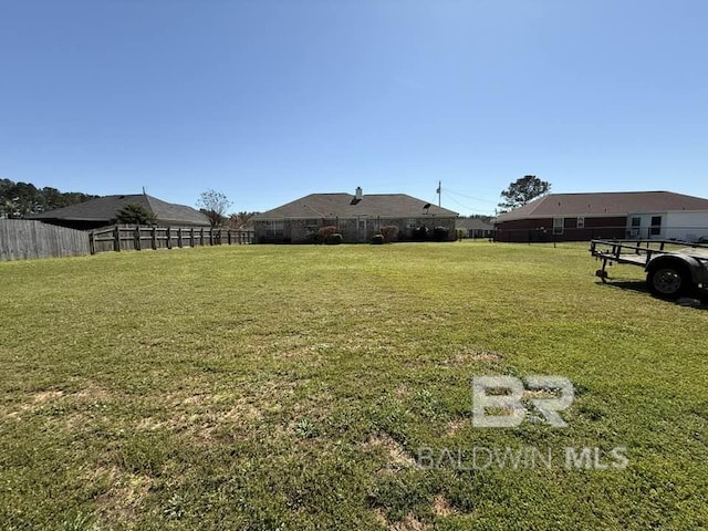 view of yard featuring fence