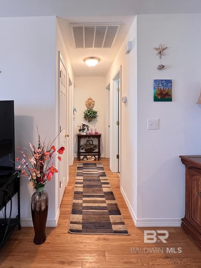 corridor featuring light wood-type flooring