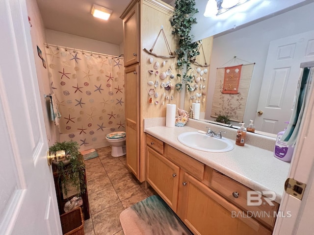 bathroom with a shower with curtain, tile patterned flooring, vanity, and toilet