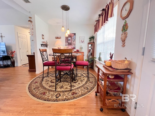 dining space featuring light wood-type flooring