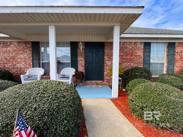 doorway to property featuring a porch