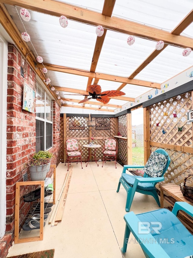 view of patio featuring ceiling fan