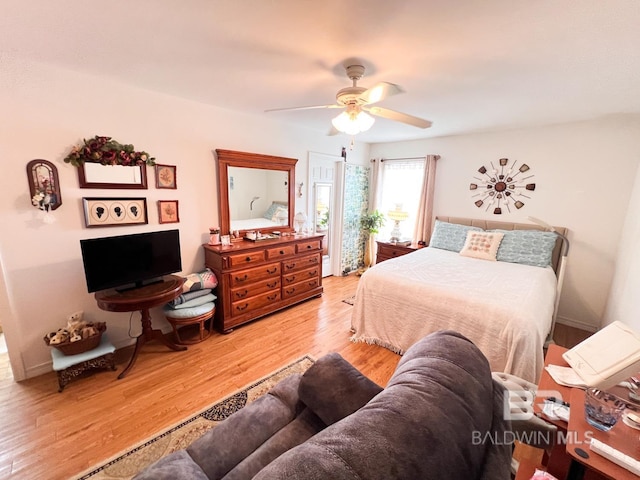 bedroom featuring ceiling fan and wood-type flooring