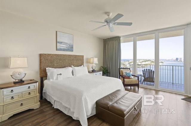 bedroom featuring ceiling fan, access to outside, dark hardwood / wood-style floors, and floor to ceiling windows