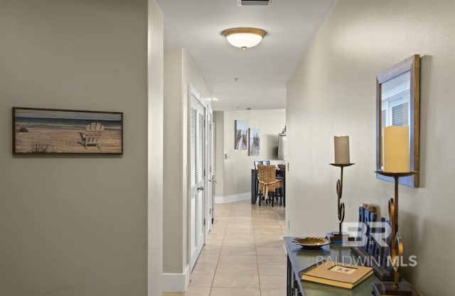 hallway with light tile patterned floors