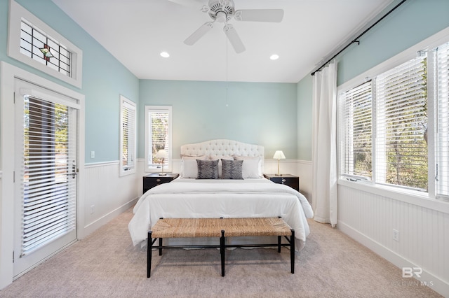 bedroom with carpet floors, access to exterior, recessed lighting, and wainscoting