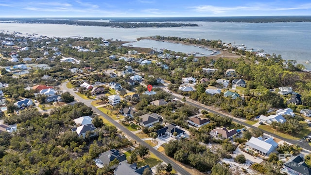 birds eye view of property with a water view and a residential view