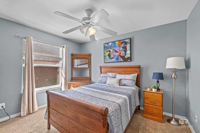 bedroom featuring carpet flooring, baseboards, and ceiling fan