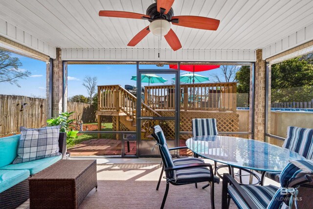 view of patio / terrace with fence, stairway, a wooden deck, outdoor dining area, and a ceiling fan