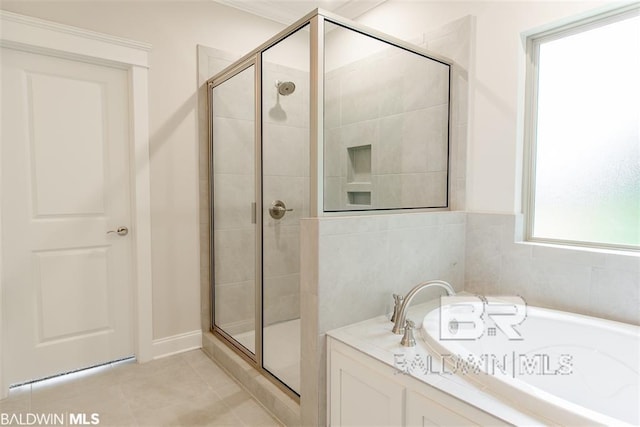 full bathroom with tile patterned floors, a stall shower, and a bath