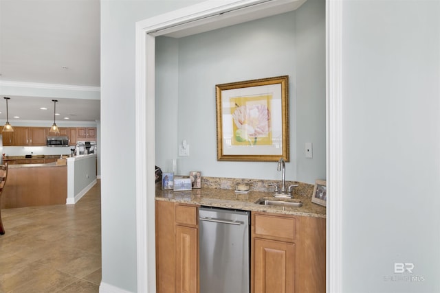 kitchen featuring pendant lighting, brown cabinets, stainless steel appliances, a sink, and light stone countertops