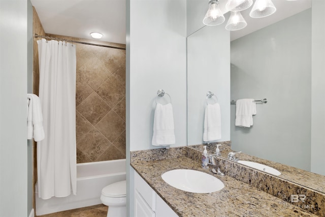 bathroom featuring toilet, shower / bath combo, and vanity