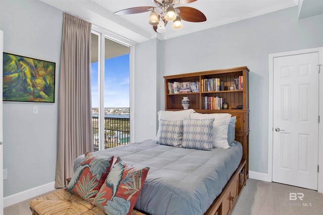 bedroom featuring carpet, access to outside, baseboards, and crown molding