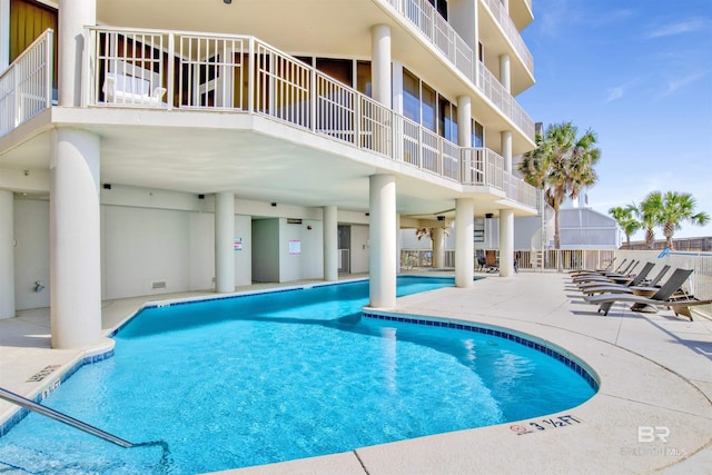 community pool with a patio area