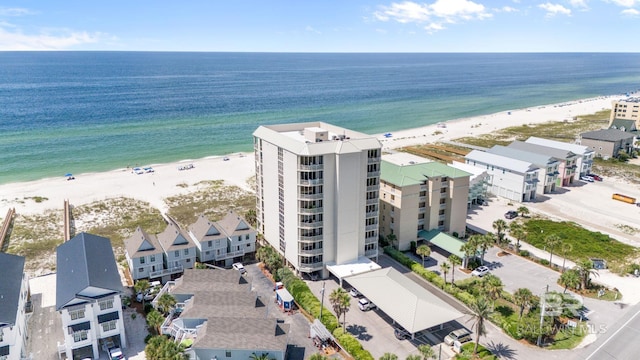 drone / aerial view with a water view and a view of the beach