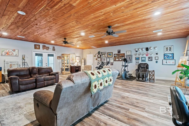 living room with light wood-type flooring, recessed lighting, wood ceiling, and french doors