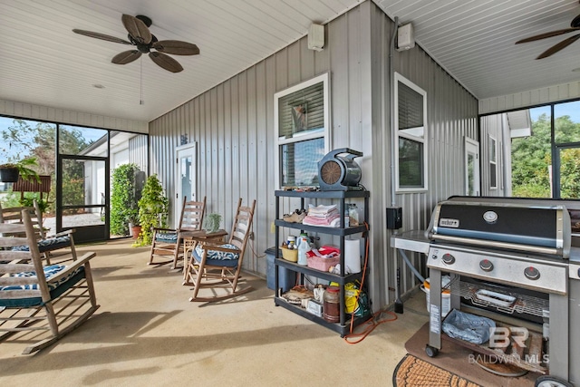 sunroom featuring ceiling fan