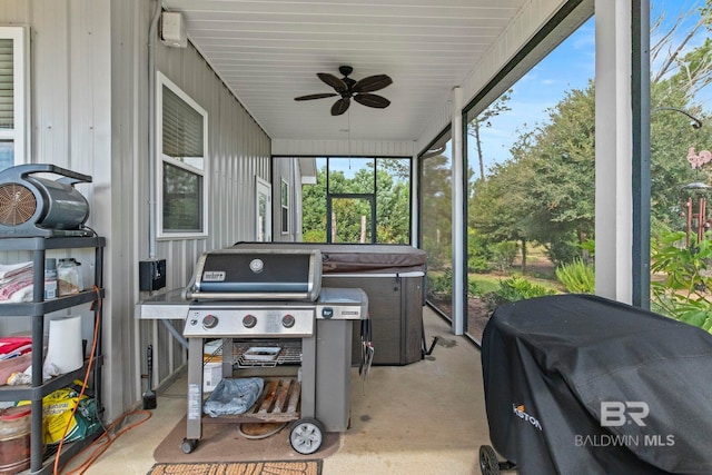 sunroom featuring a ceiling fan