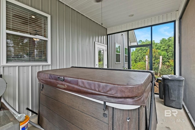 view of patio / terrace with a hot tub