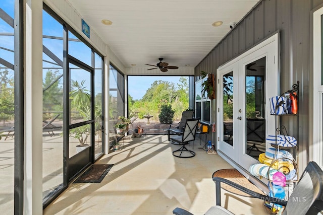 sunroom / solarium featuring french doors