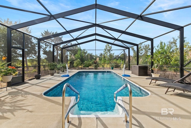 pool with a lanai and a patio