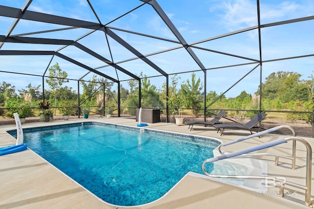 outdoor pool with a lanai and a patio