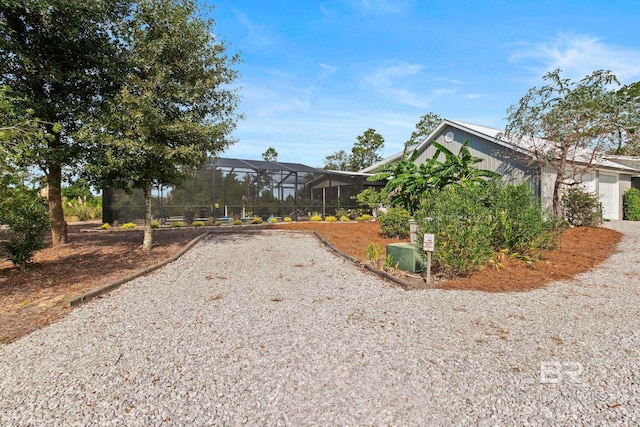 view of front of home featuring a garage and a lanai