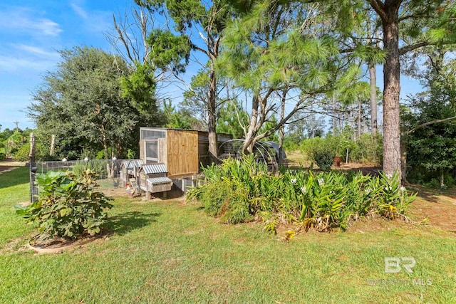 view of yard featuring an outbuilding and exterior structure