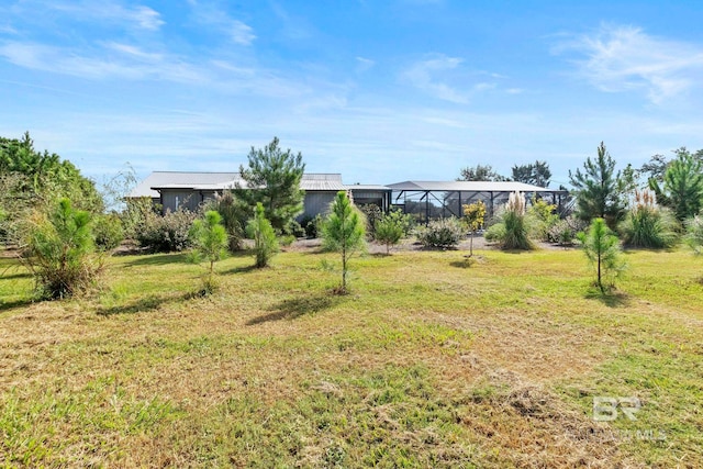view of yard with a lanai