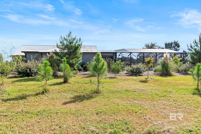 view of yard featuring a lanai
