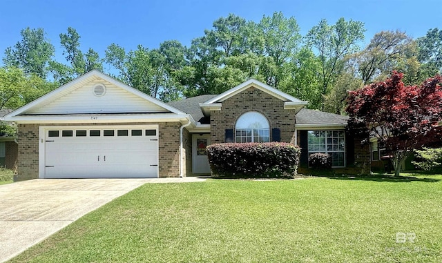 1549 E Augusta Dr, Mobile, AL 36695 - view of front of home featuring a garage, driveway, a front lawn, and brick siding