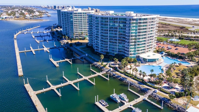aerial view of a nearby body of water and apartment complex / building