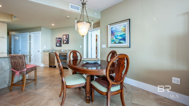 dining area featuring baseboards, light tile patterned flooring, and recessed lighting