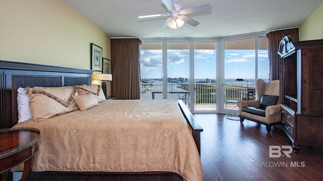 bedroom with floor to ceiling windows, access to exterior, wood finished floors, a water view, and ceiling fan