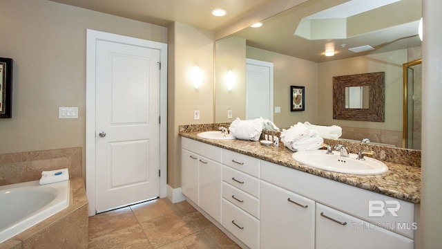 full bath featuring double vanity, a bath, and a shower with door