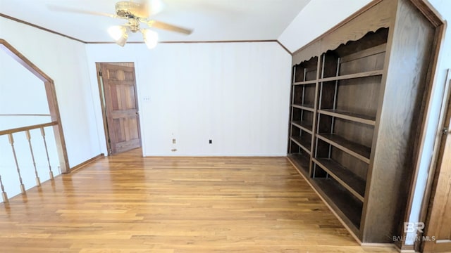 interior space with light wood-type flooring, ceiling fan, and crown molding